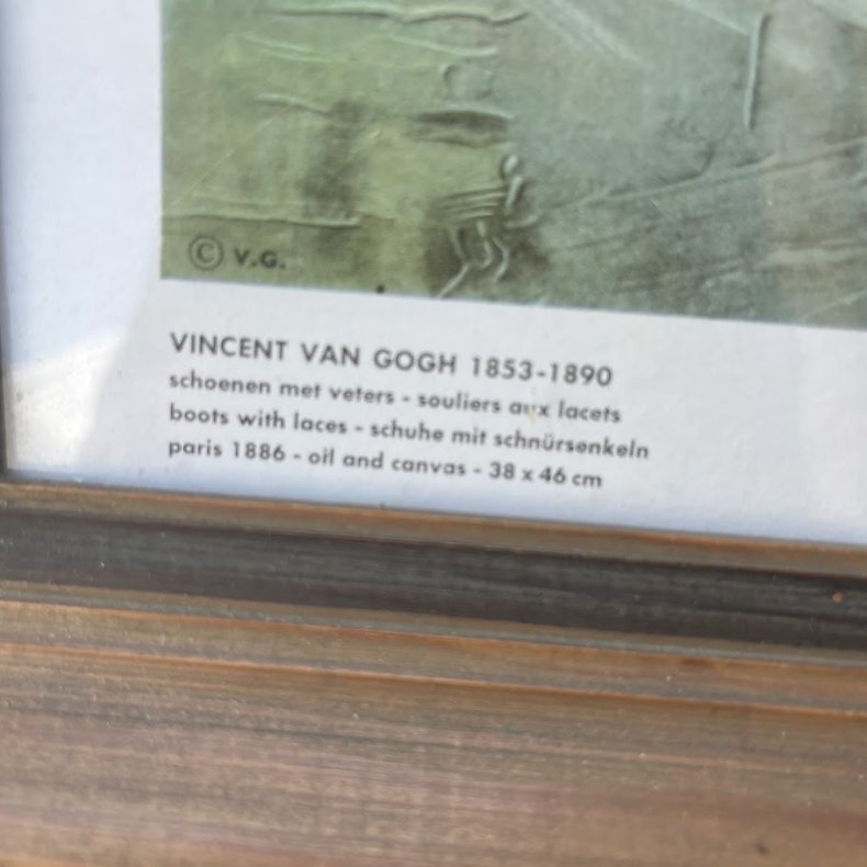Kunsttryk af et par slidte st�vler
